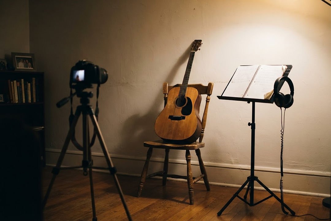 A small camera on a tripod set up in a home practice room